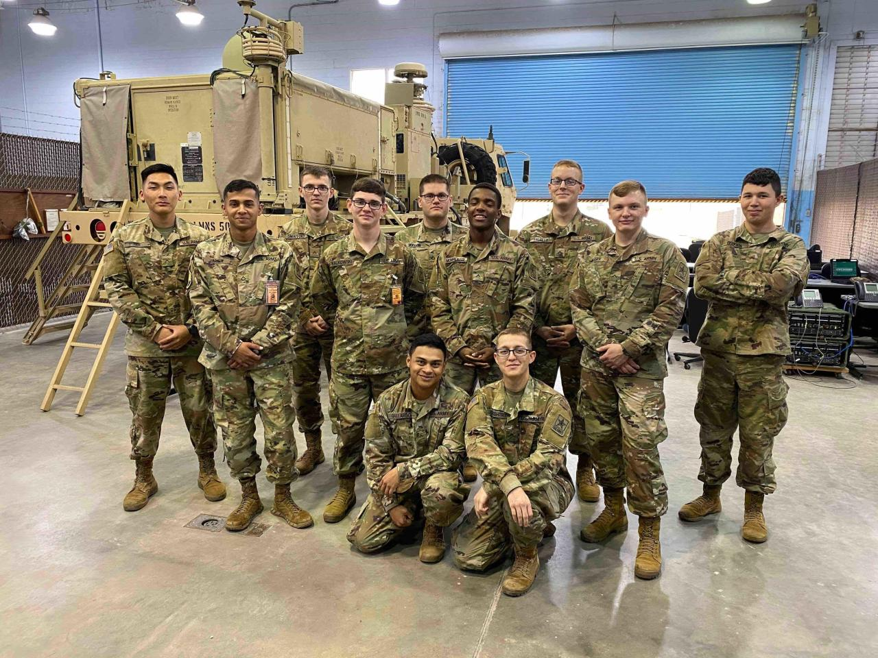 U.S. Army AIT class posing after completing final tests shortly before graduation.