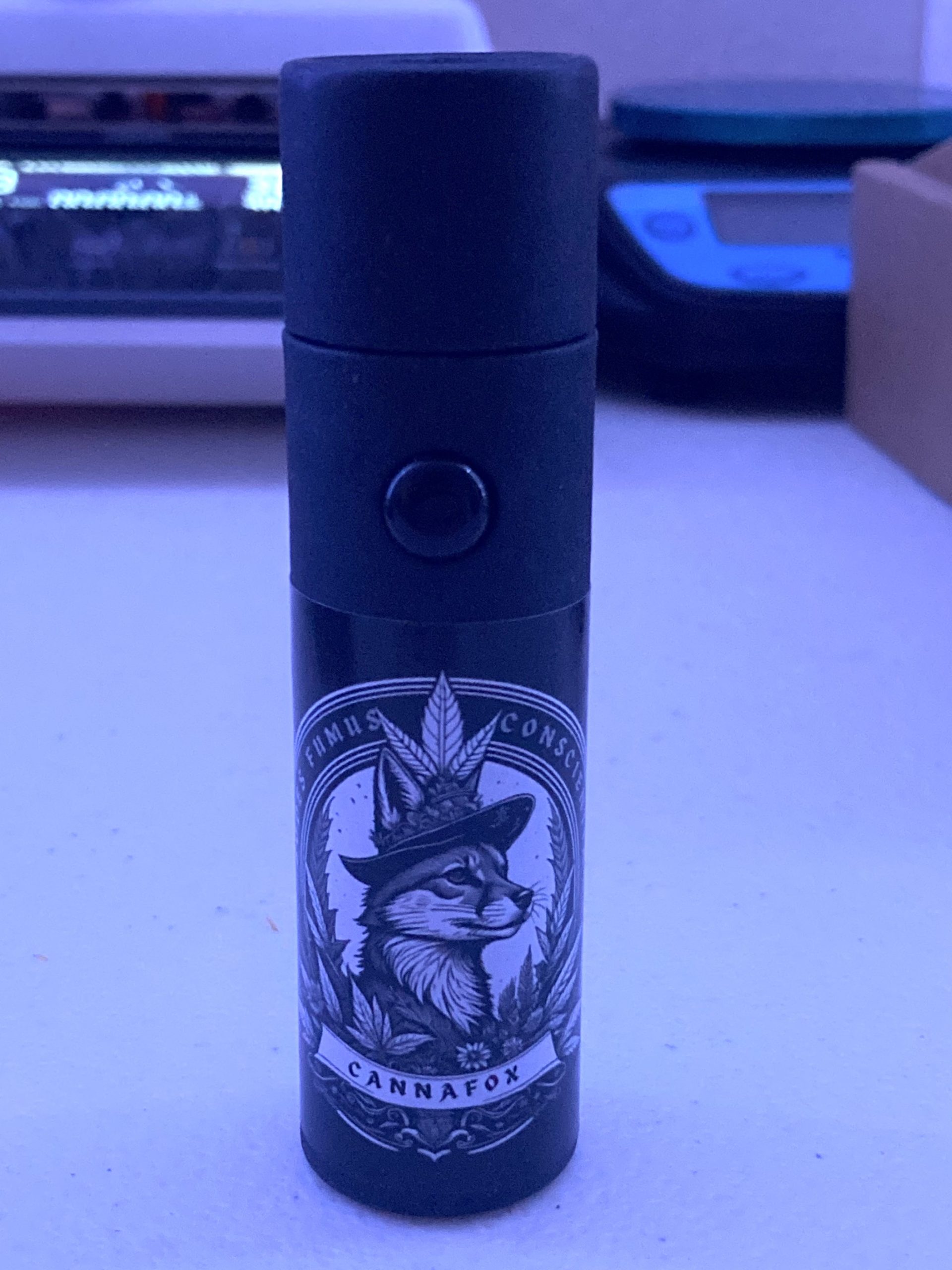 Closed CannaFox branded cylindrical cartridge package